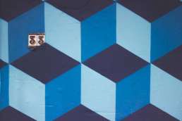 Blue chevron wall with the number 33 written on it