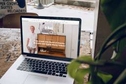 Laptop displaying a designer's website