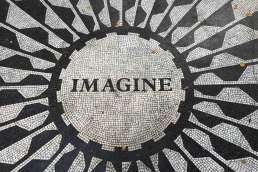 Imagine written with black and white tile along with a pattern