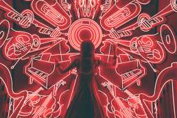 Woman standing in front of neon red lights formed like musical instruments