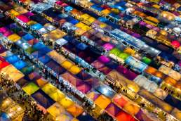 Colorful tents lit up at night