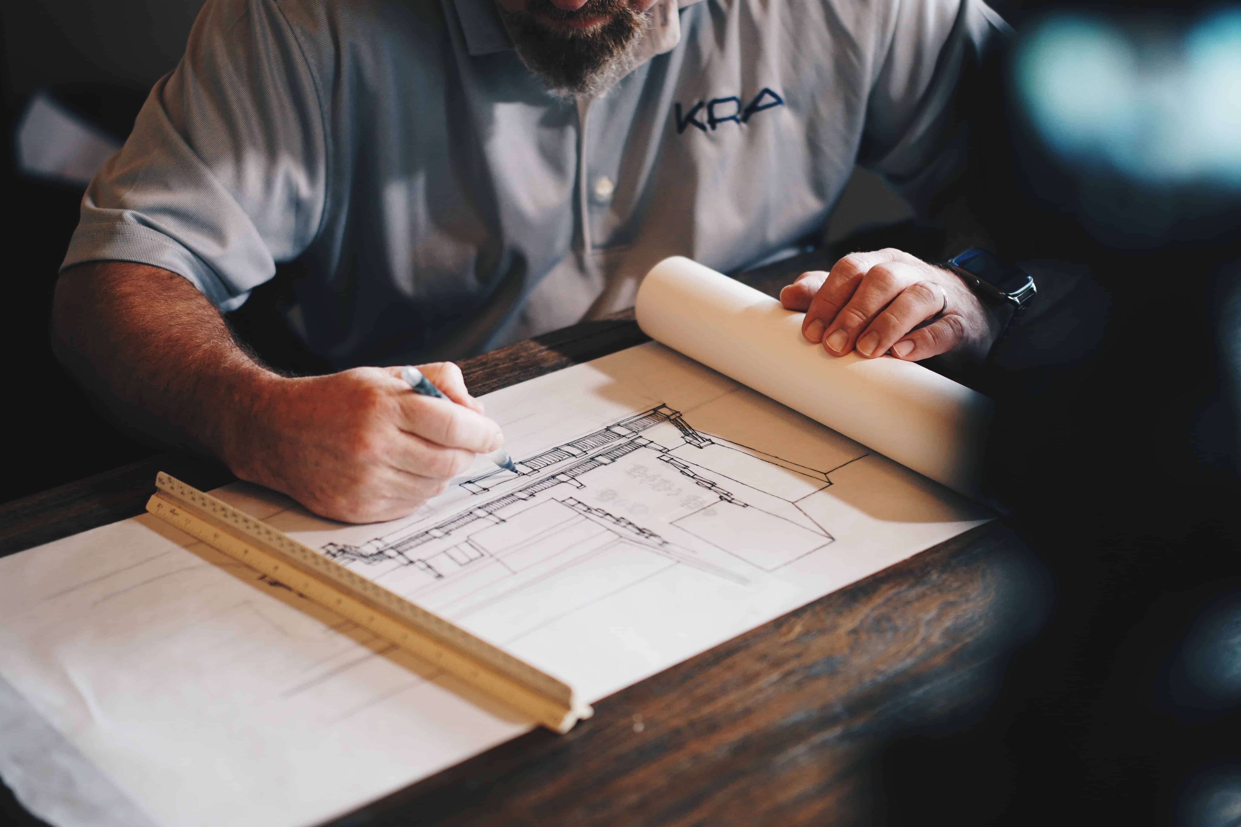 Man working on architectural plans