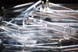 Empty test tubes laying in a pile