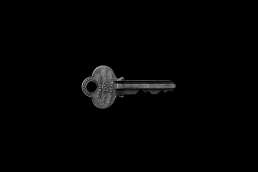 Key against a black background