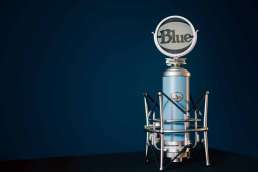 Blue Microphone against blue background