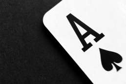 Black and white photo of the corner of an ace playing card