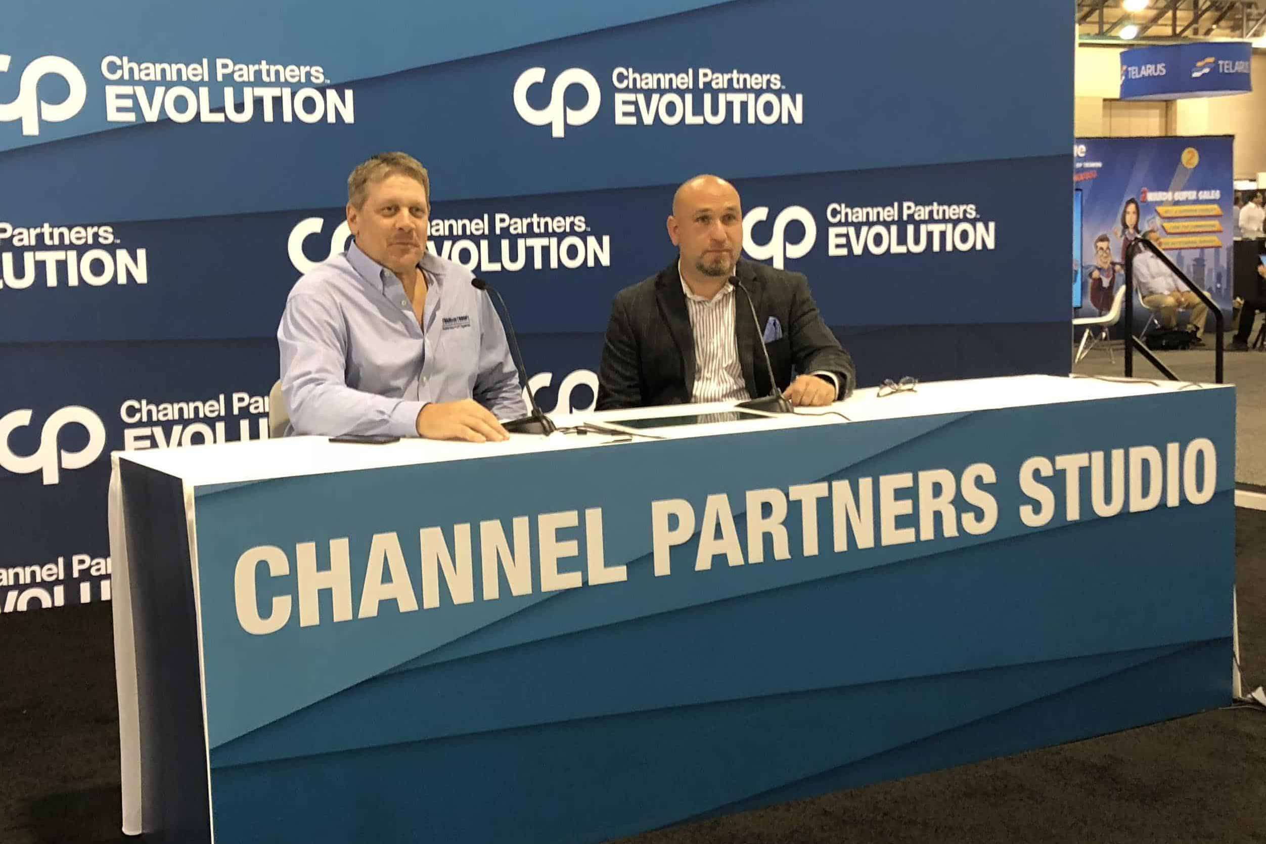 Two men presenting at Channel Partners Evolution studio booth