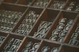letters on a printing press