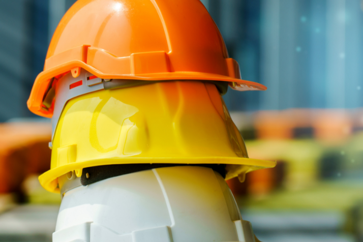 Stack of hard hats on a construction site